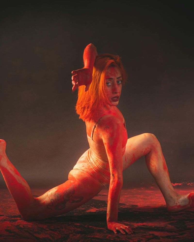 Person in a fluid yoga movement, captured mid-pose.